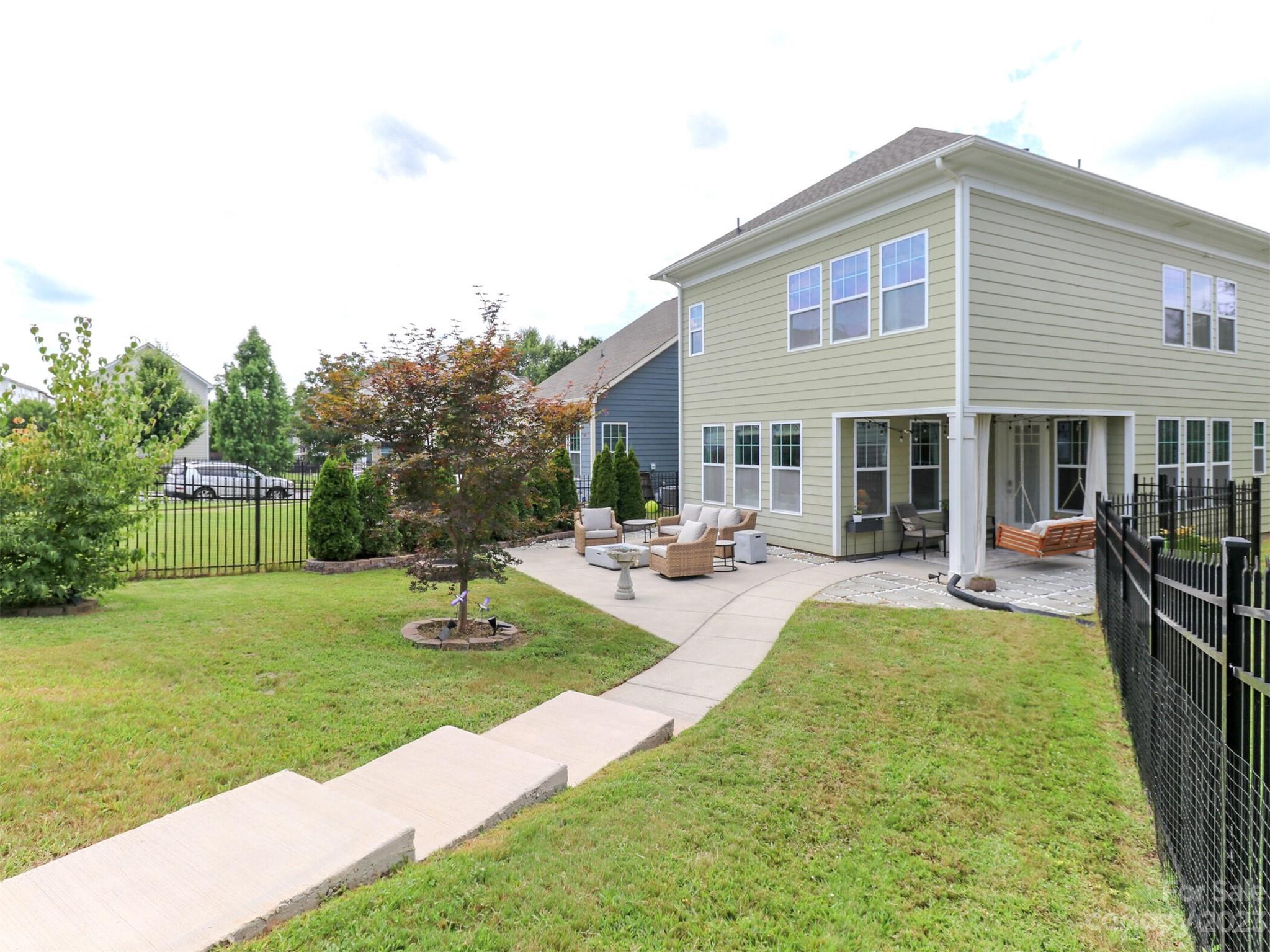 2634 Double Oaks Road Charlotte, NC 28206 - Photo 38 of 48 a view of a house with swimming pool and a yard