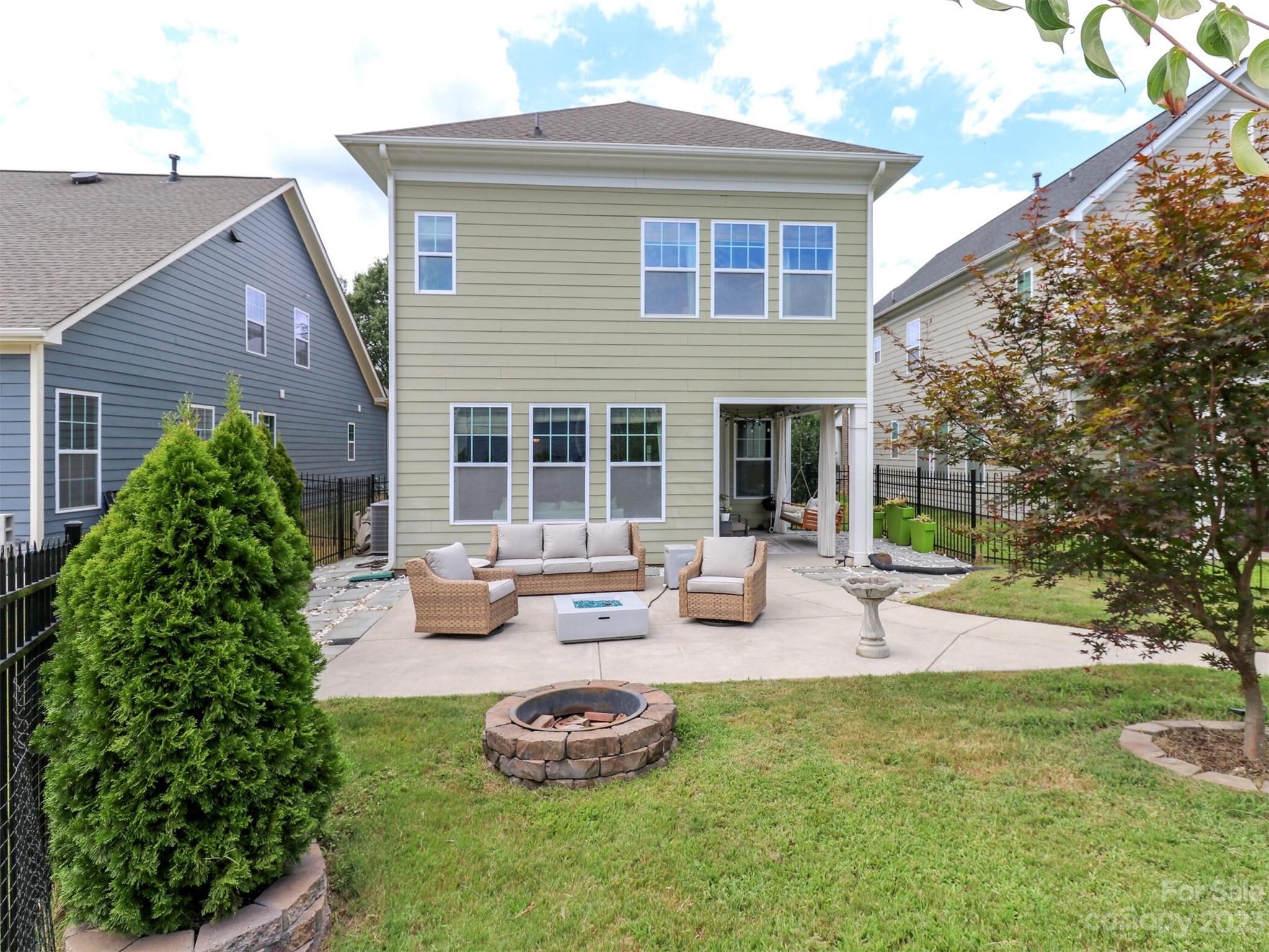 2634 Double Oaks Road Charlotte, NC 28206 - Photo 39 of 48 a view of a house with backyard sitting area and garden