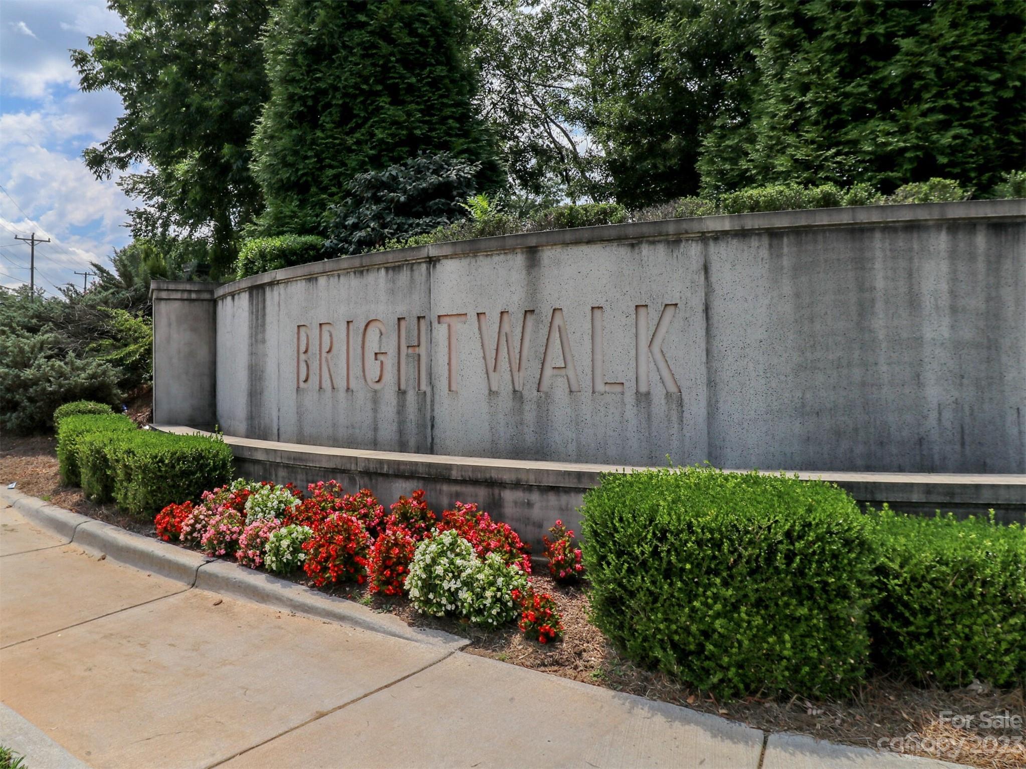 2634 Double Oaks Road Charlotte, NC 28206 - Photo 43 of 48 a wooden fence with flowers in front of potted plants