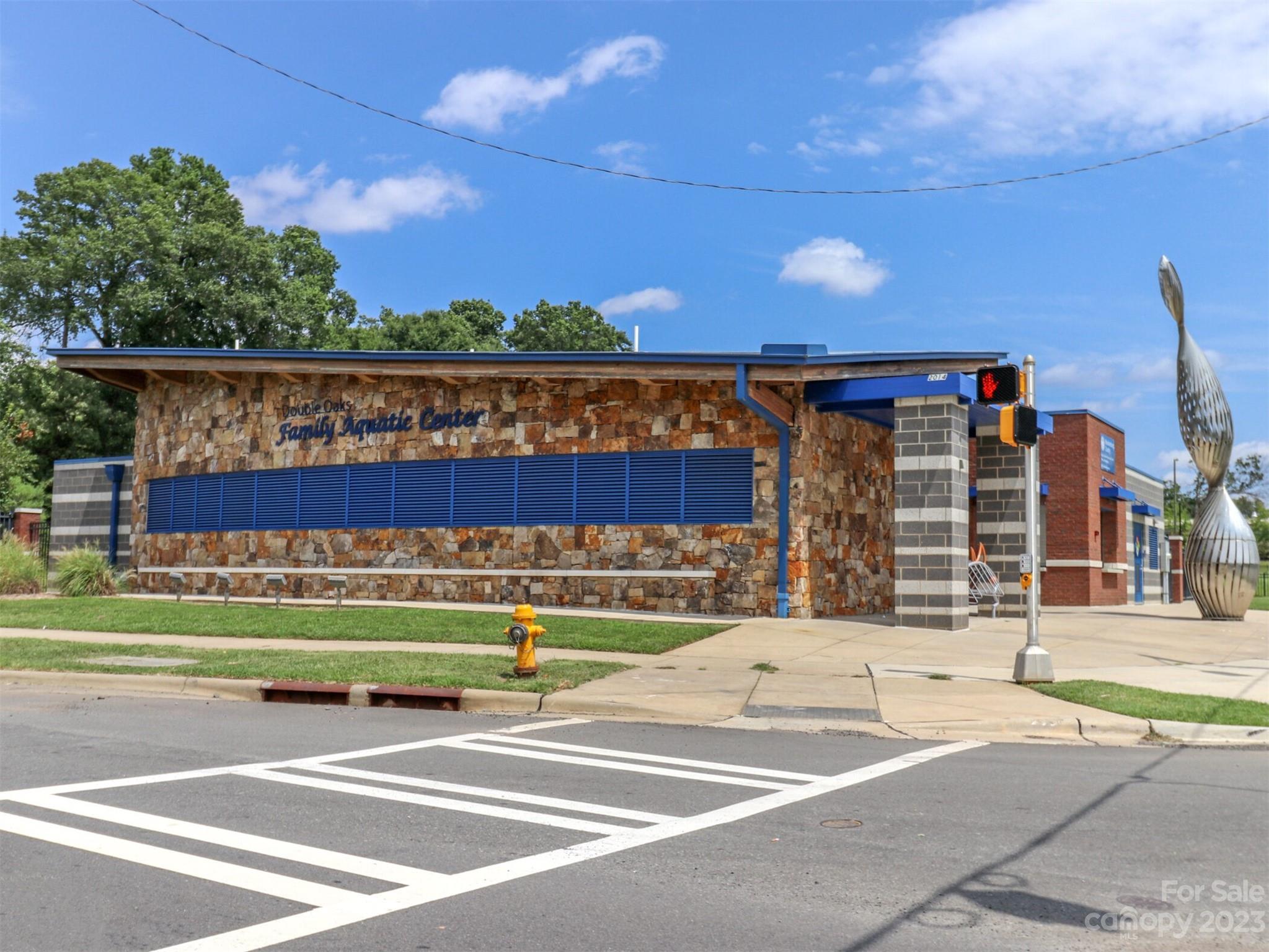 2634 Double Oaks Road Charlotte, NC 28206 - Photo 46 of 48 a view of a building with a swimming pool