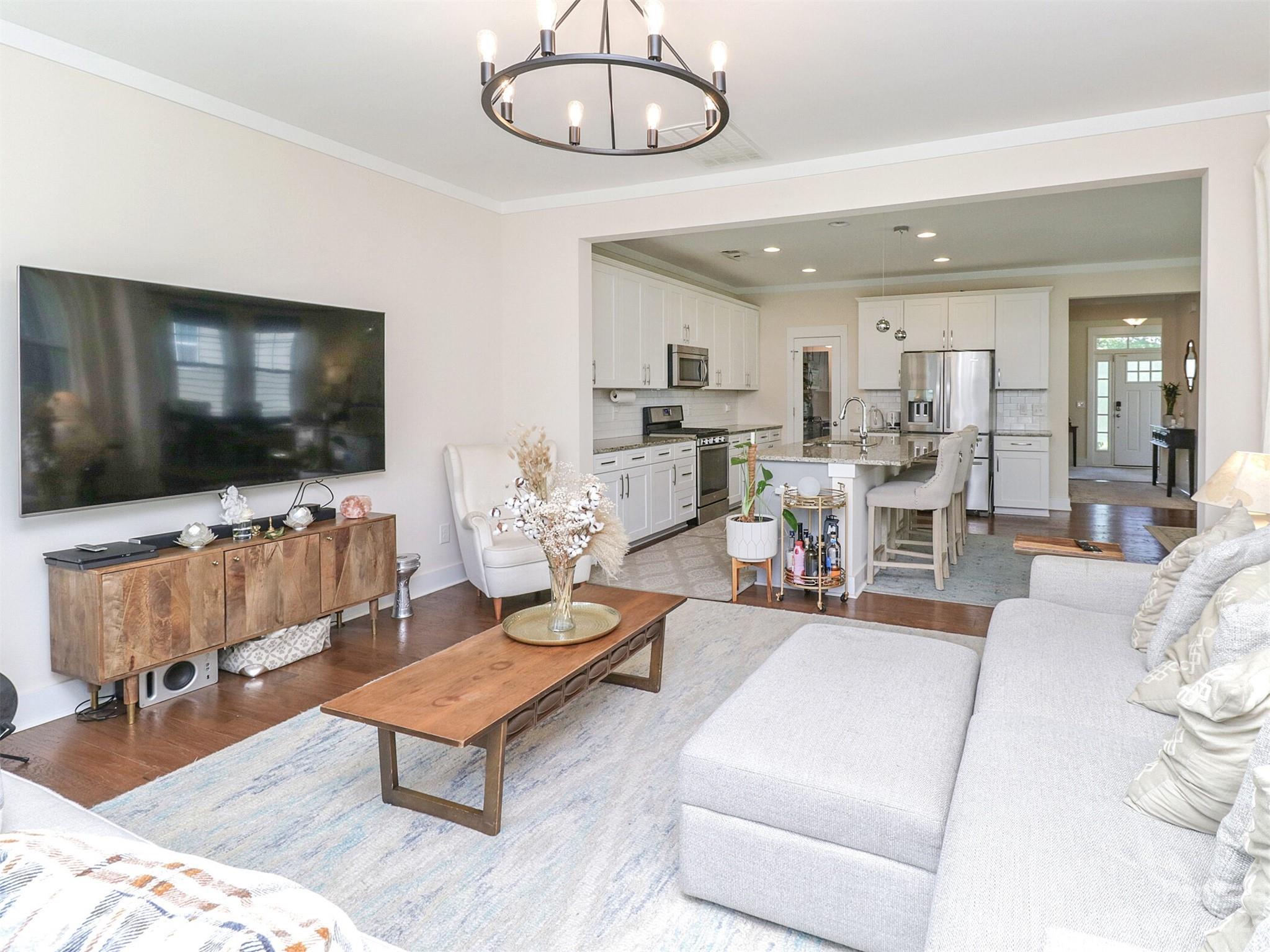 2634 Double Oaks Road Charlotte, NC 28206 - Photo 8 of 48 a living room with furniture and a flat screen tv