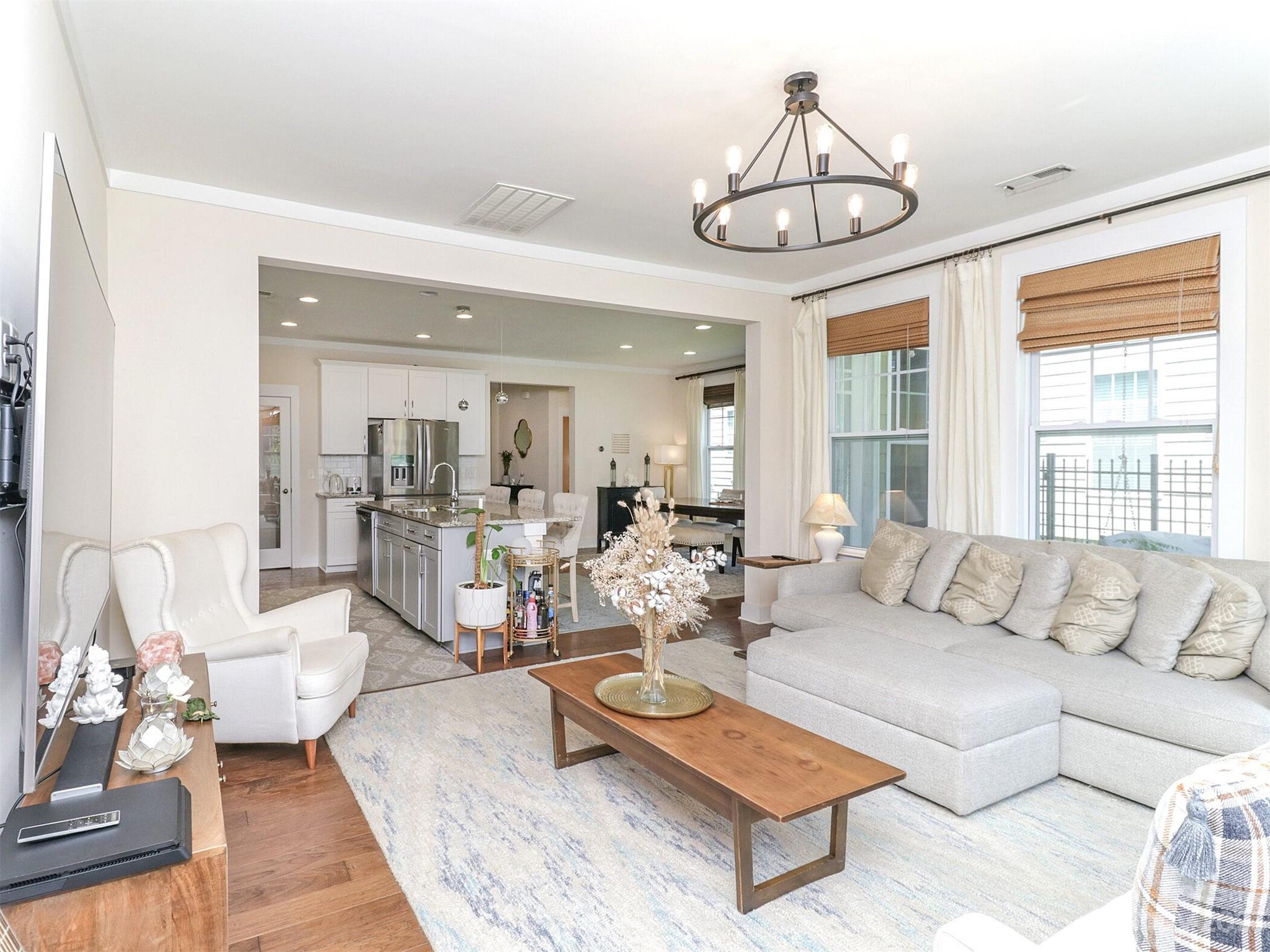 2634 Double Oaks Road Charlotte, NC 28206 - Photo 10 of 48 a living room with furniture a chandelier and a large window