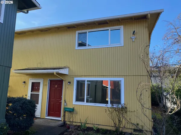 a view of a house with a door and a window