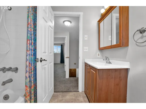a bathroom with a toilet a sink and bathtub