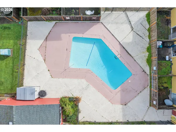 a view of a backyard with sitting area