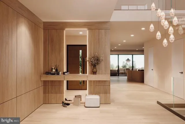 a lobby with furniture and a large mirror