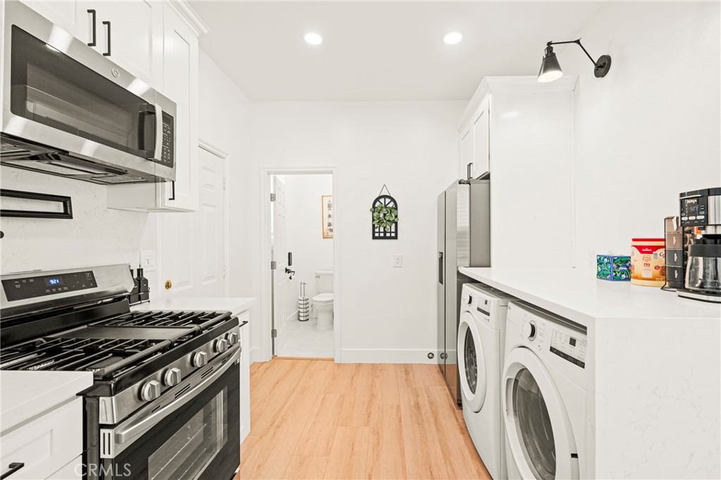 1014 Myrtle Avenue Long Beach, CA 90813 - Photo 13 of 70 a kitchen with a stove and a refrigerator