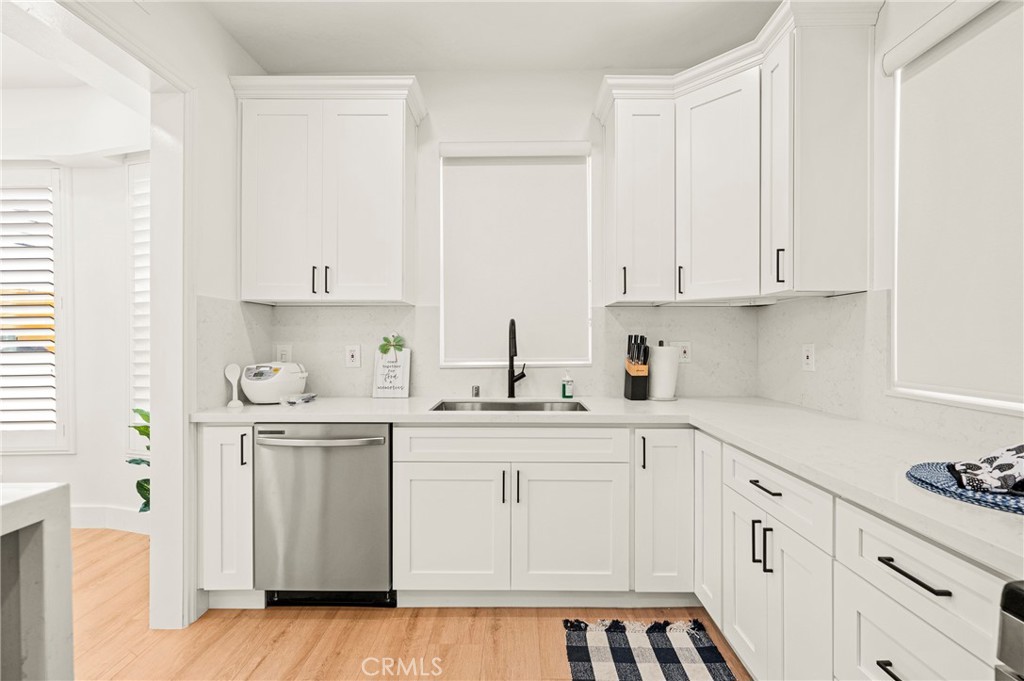 1014 Myrtle Avenue Long Beach, CA 90813 - Photo 14 of 70 a kitchen with white cabinets white appliances sink and dishwasher