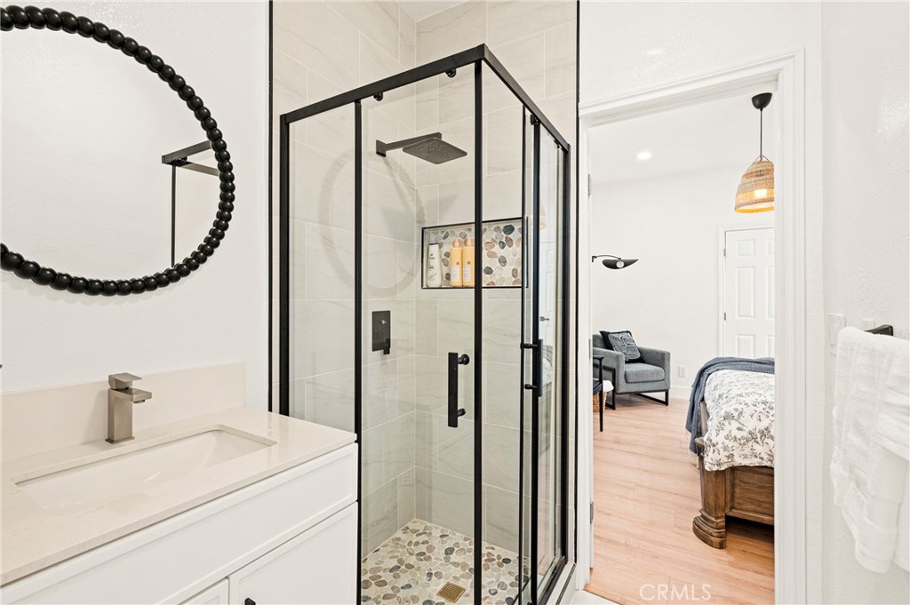 1014 Myrtle Avenue Long Beach, CA 90813 - Photo 16 of 70 a en suite bathroom with a shower sink and mirror