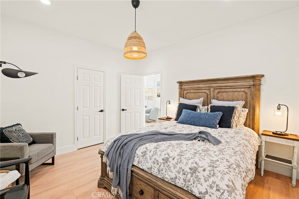 1014 Myrtle Avenue Long Beach, CA 90813 - Photo 17 of 70 a bedroom with a bed and wooden floor