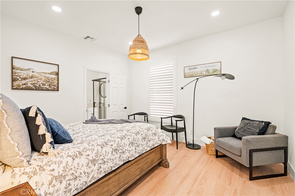 1014 Myrtle Avenue Long Beach, CA 90813 - Photo 18 of 70 a bedroom with a bed couch and a window