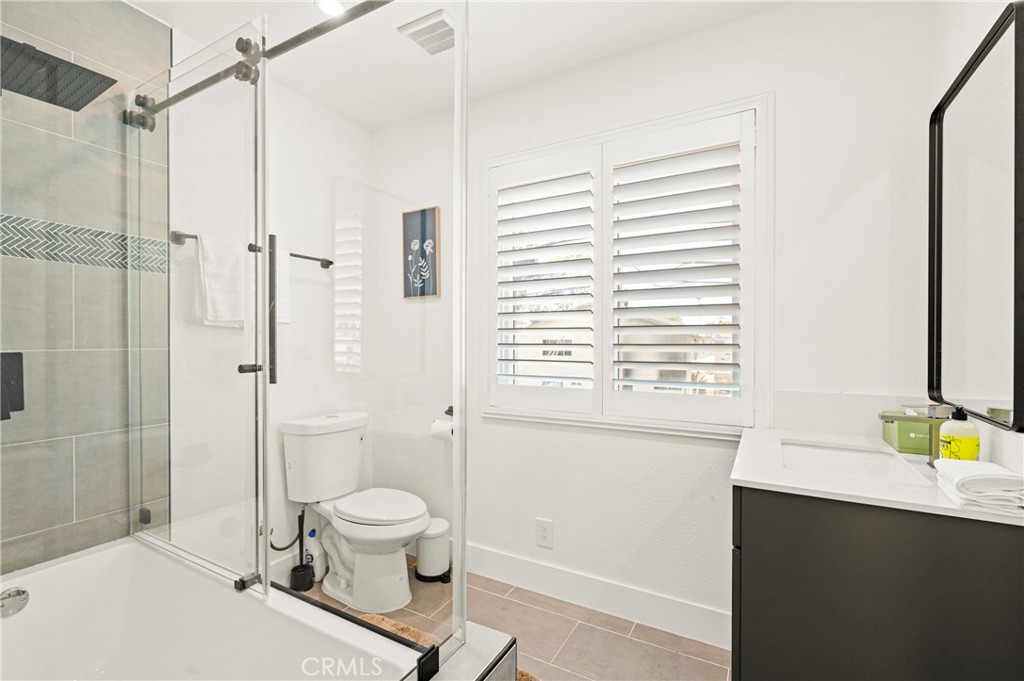 1014 Myrtle Avenue Long Beach, CA 90813 - Photo 24 of 70 a bathroom with a granite countertop sink toilet and shower
