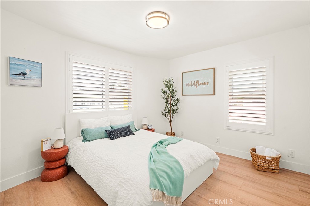 1014 Myrtle Avenue Long Beach, CA 90813 - Photo 25 of 70 a bedroom with a bed and wooden floor