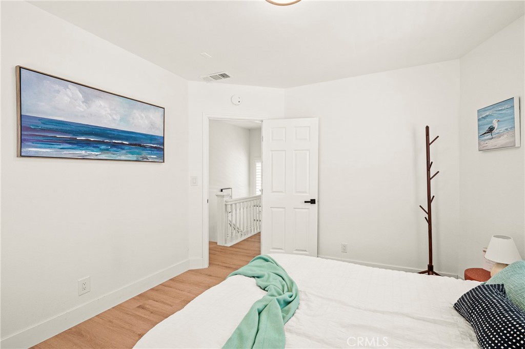 1014 Myrtle Avenue Long Beach, CA 90813 - Photo 27 of 70 a bedroom with a bed and hallway