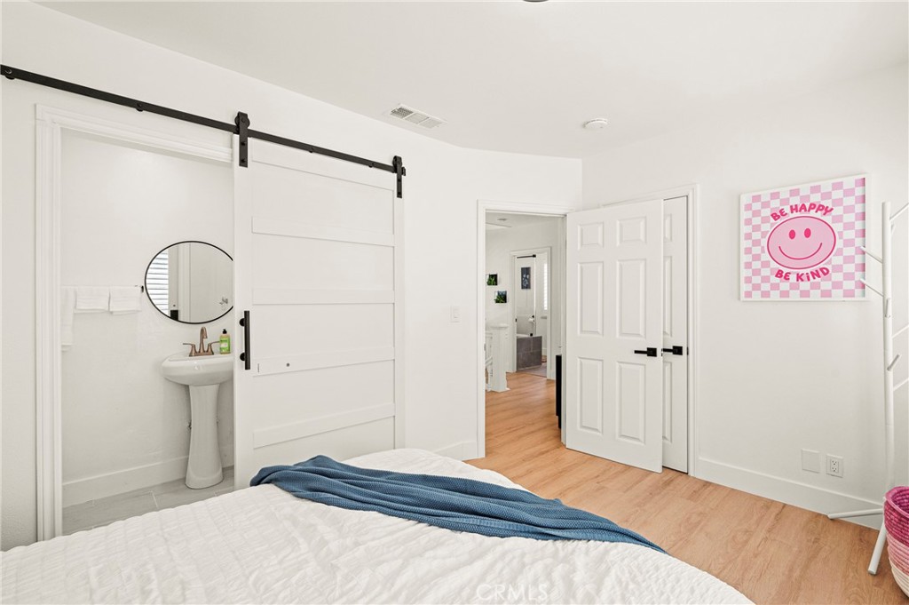 1014 Myrtle Avenue Long Beach, CA 90813 - Photo 30 of 70 a bedroom with a bed and a dresser