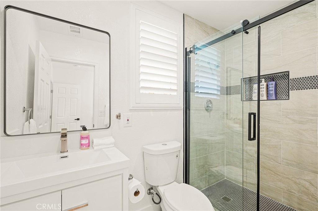 1014 Myrtle Avenue Long Beach, CA 90813 - Photo 35 of 70 a bathroom with a sink a toilet and shower