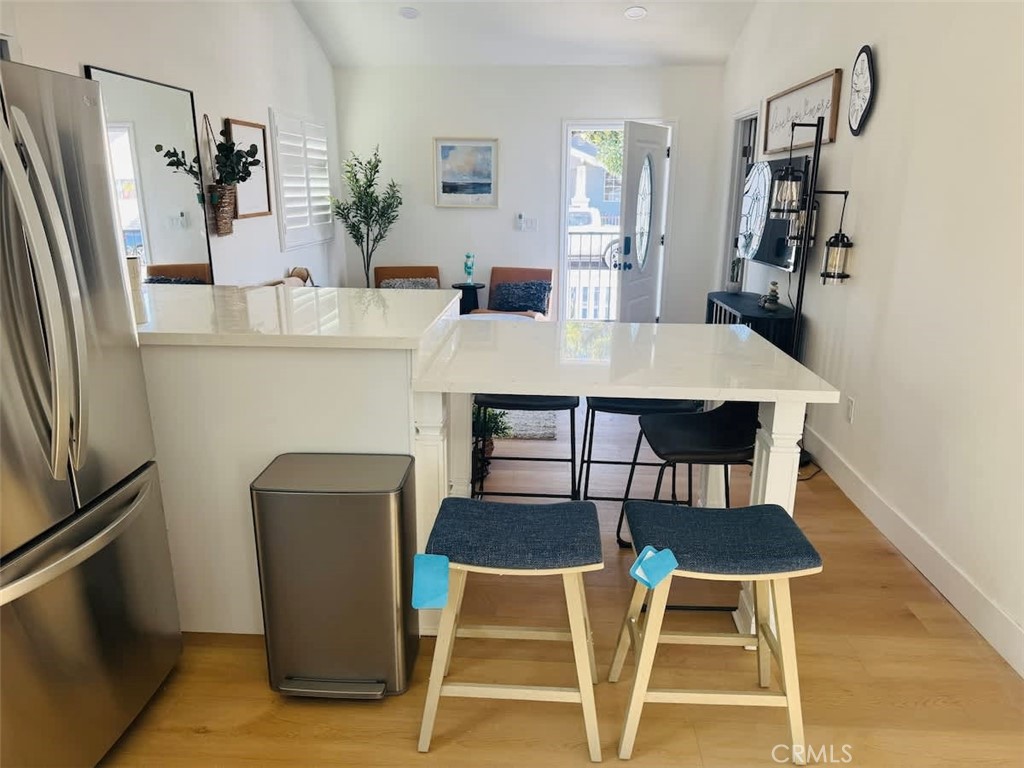 1014 Myrtle Avenue Long Beach, CA 90813 - Photo 44 of 70 a dining room with furniture and wooden floor