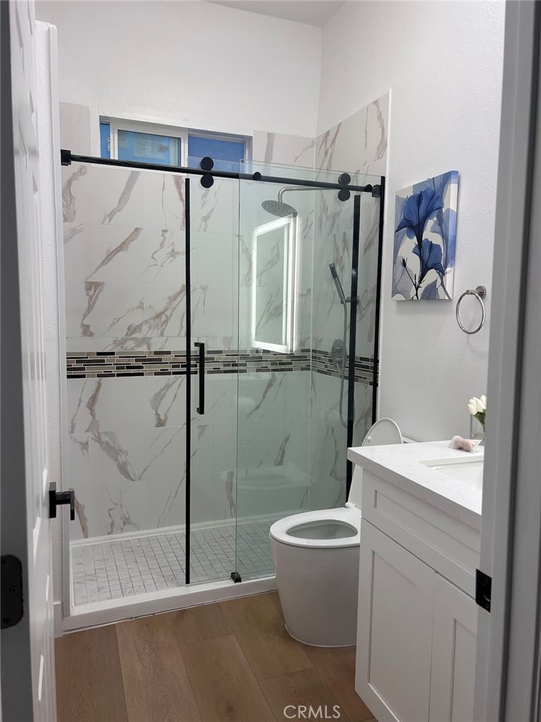 1014 Myrtle Avenue Long Beach, CA 90813 - Photo 52 of 70 a bathroom with a shower a toilet and a sink