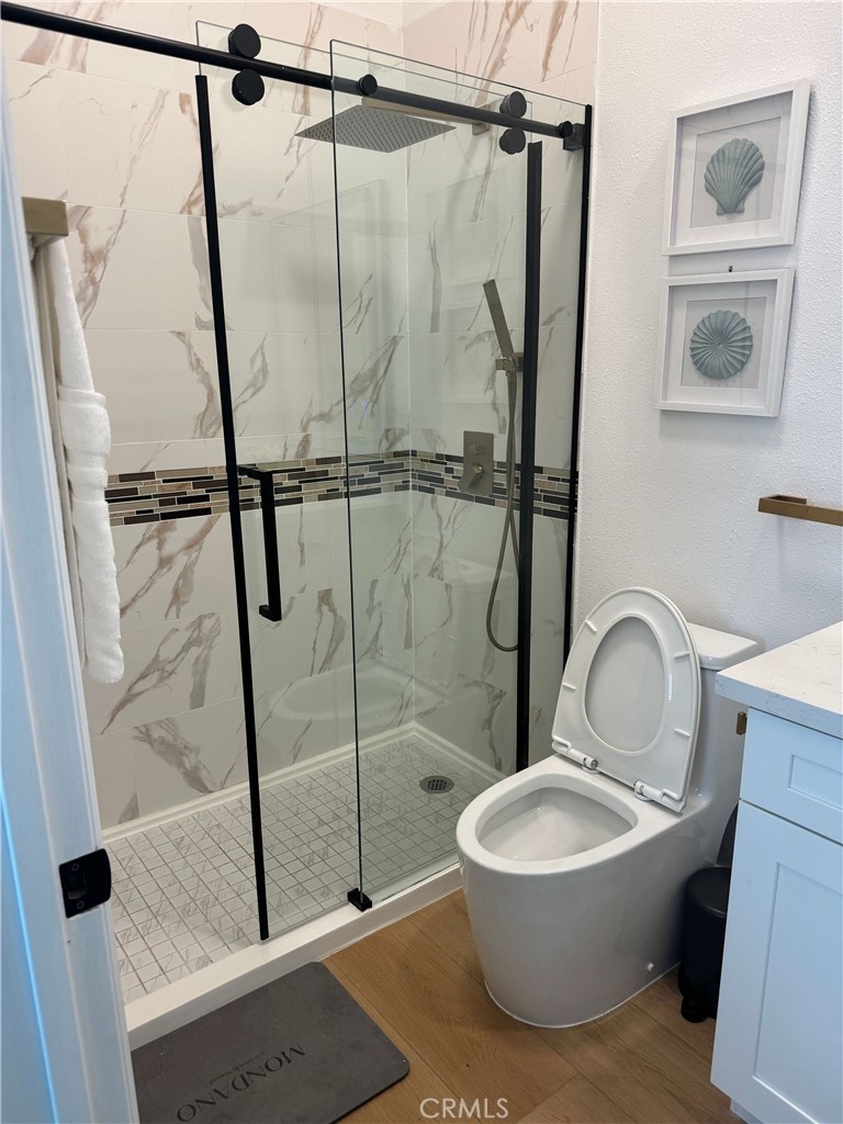 1014 Myrtle Avenue Long Beach, CA 90813 - Photo 53 of 70 a bathroom with a granite countertop sink toilet and a shower