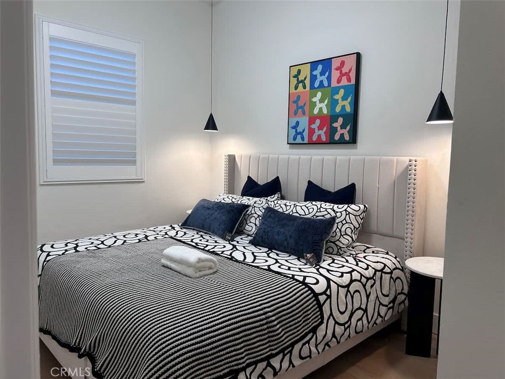 1014 Myrtle Avenue Long Beach, CA 90813 - Photo 55 of 70 a large bed sitting in a bedroom next to a window