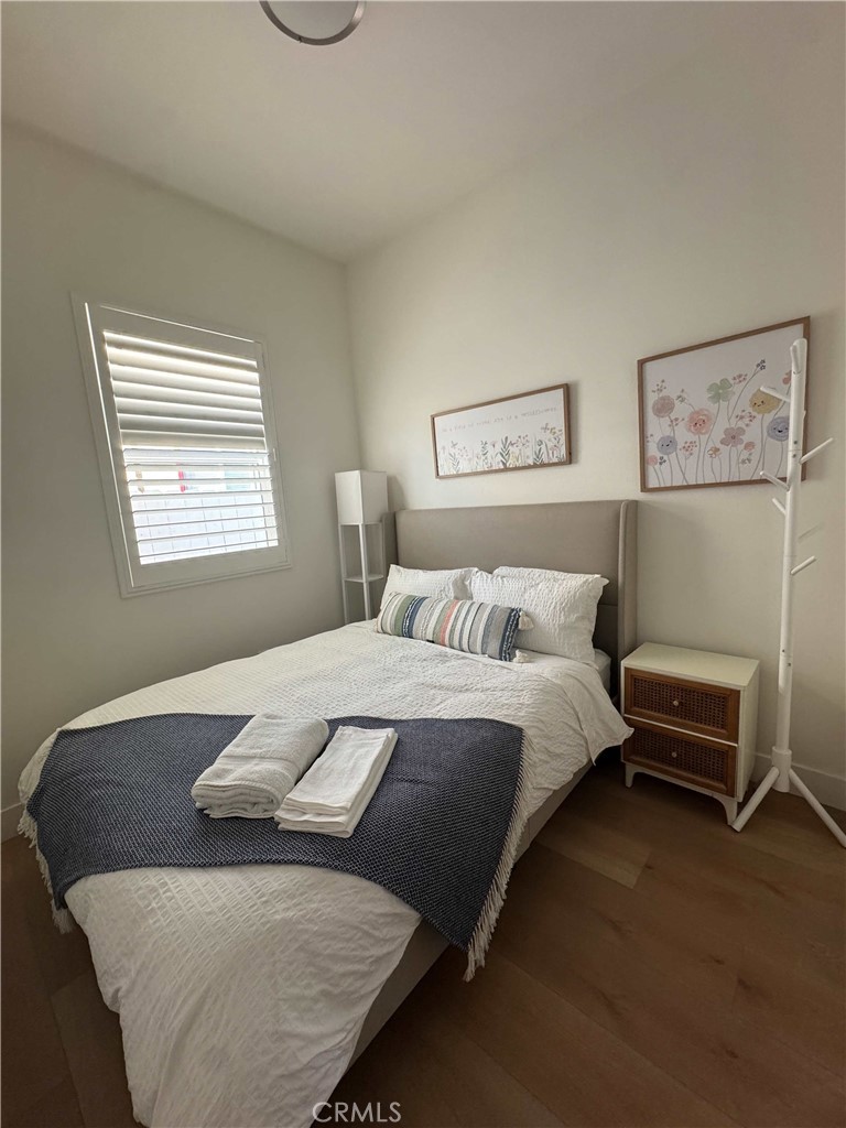 1014 Myrtle Avenue Long Beach, CA 90813 - Photo 59 of 70 a bed sitting in a bedroom next to a window
