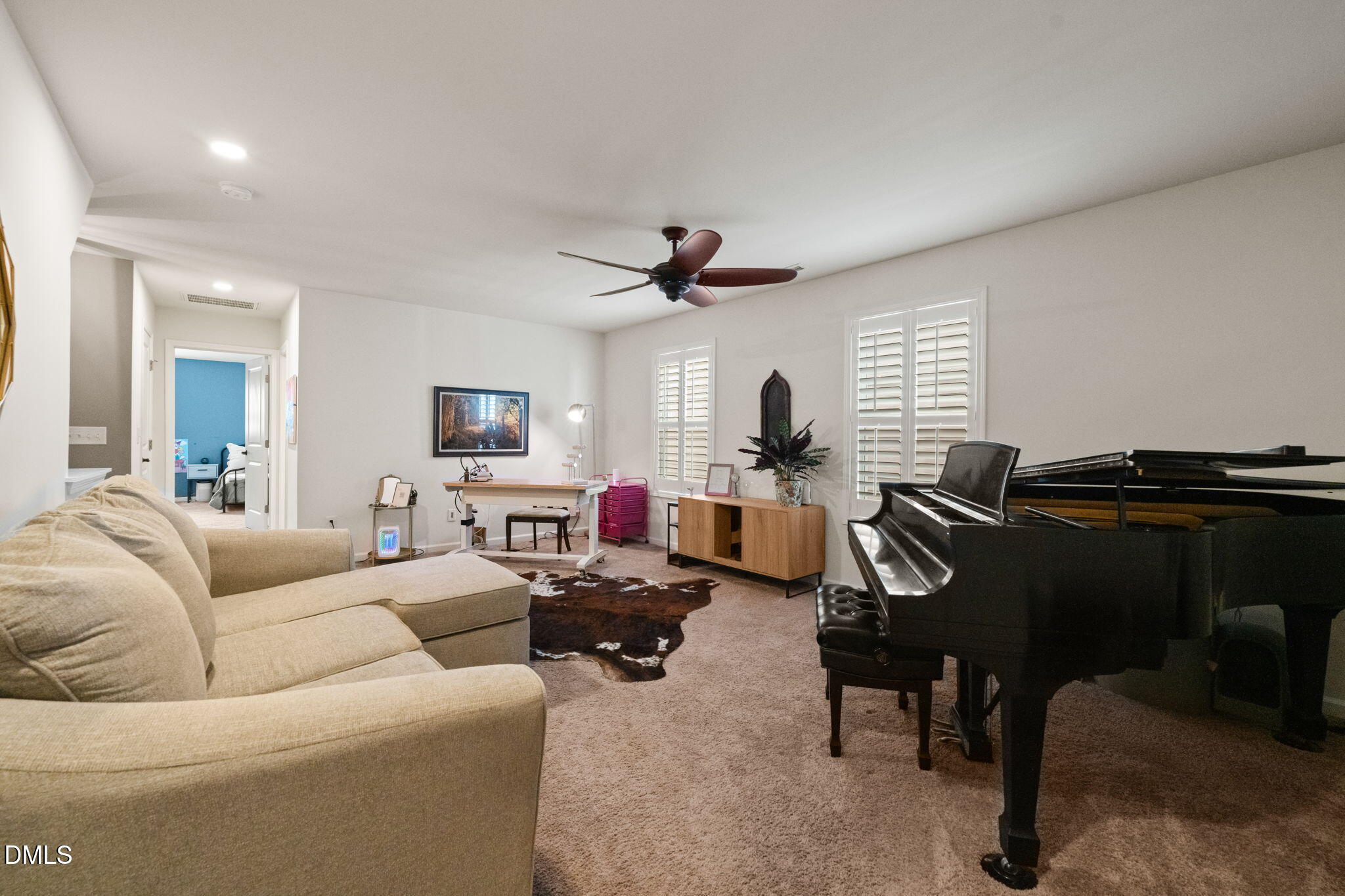 1716 Main Divide Drive Wake Forest, NC 27587 - Photo 27 of 45 a living room with furniture ceiling fan and a window