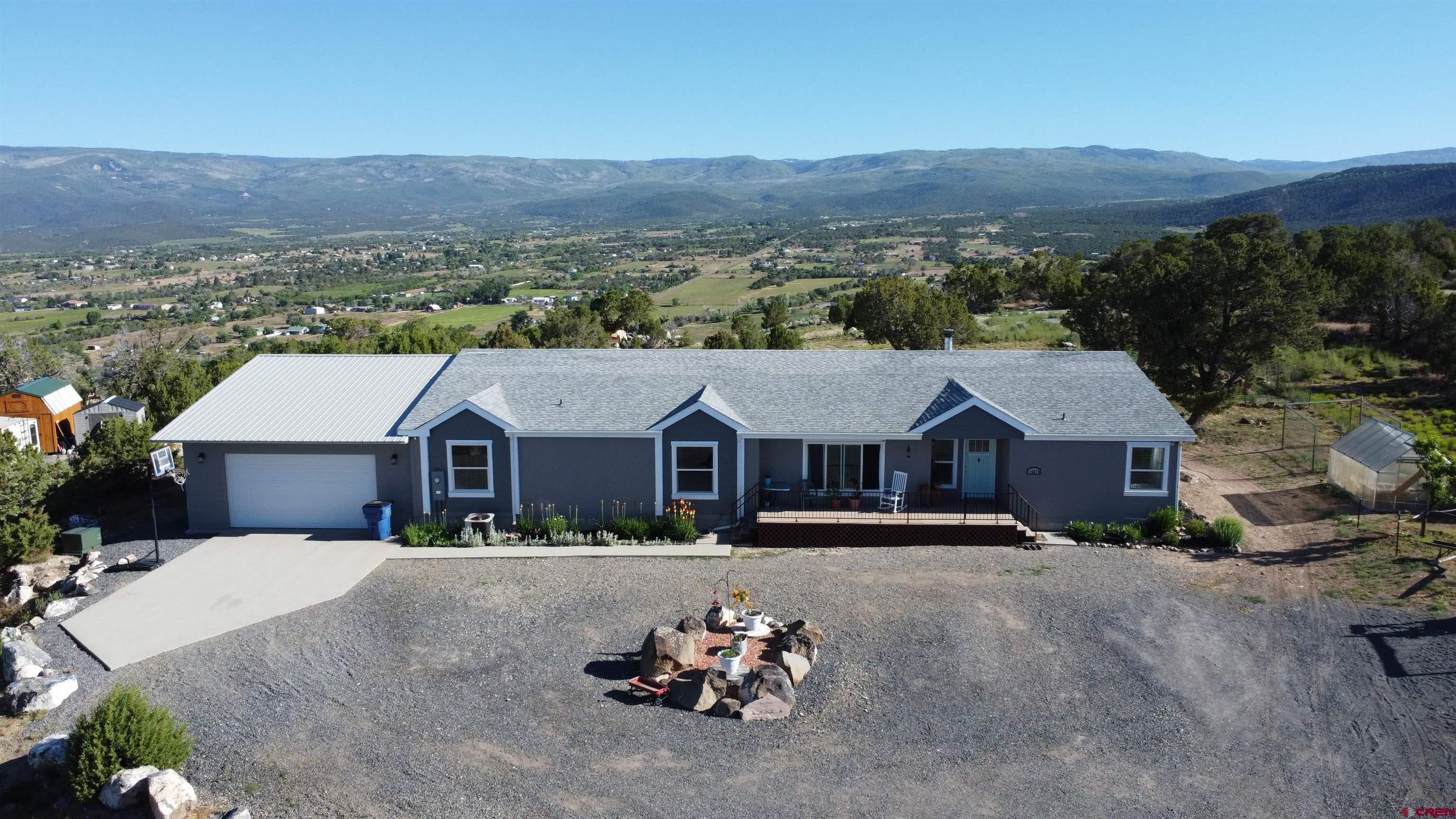 16875 Ember Road Cedaredge, CO 81413 - Photo 1 of 31 a view of a house with a outdoor space
