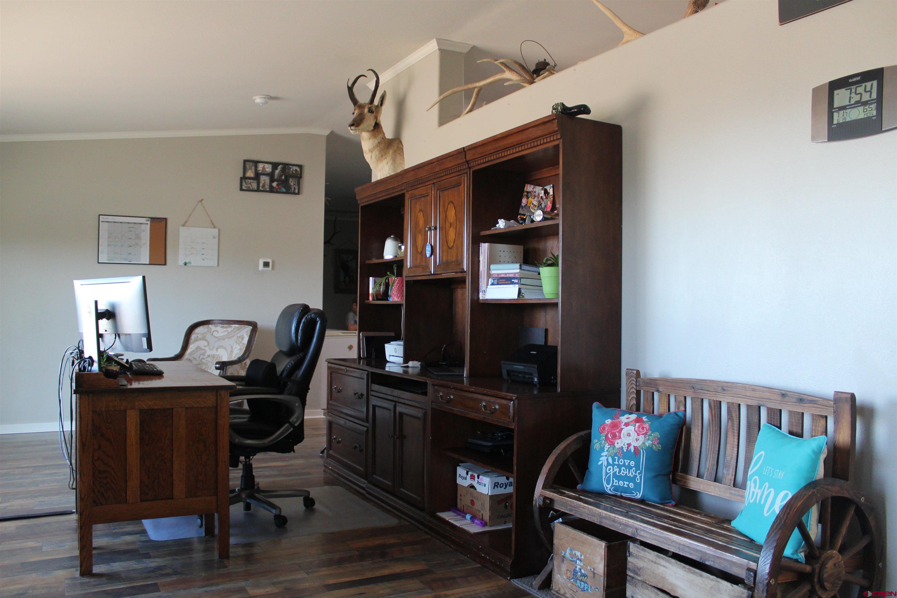 16875 Ember Road Cedaredge, CO 81413 - Photo 15 of 31 a view of a workspace with furniture and a window