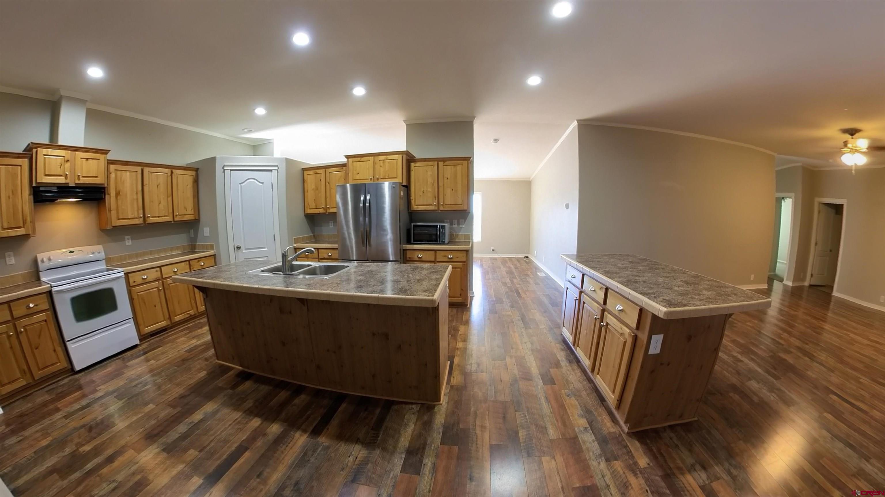 16875 Ember Road Cedaredge, CO 81413 - Photo 30 of 31 a view of kitchen with sink microwave and refrigerator