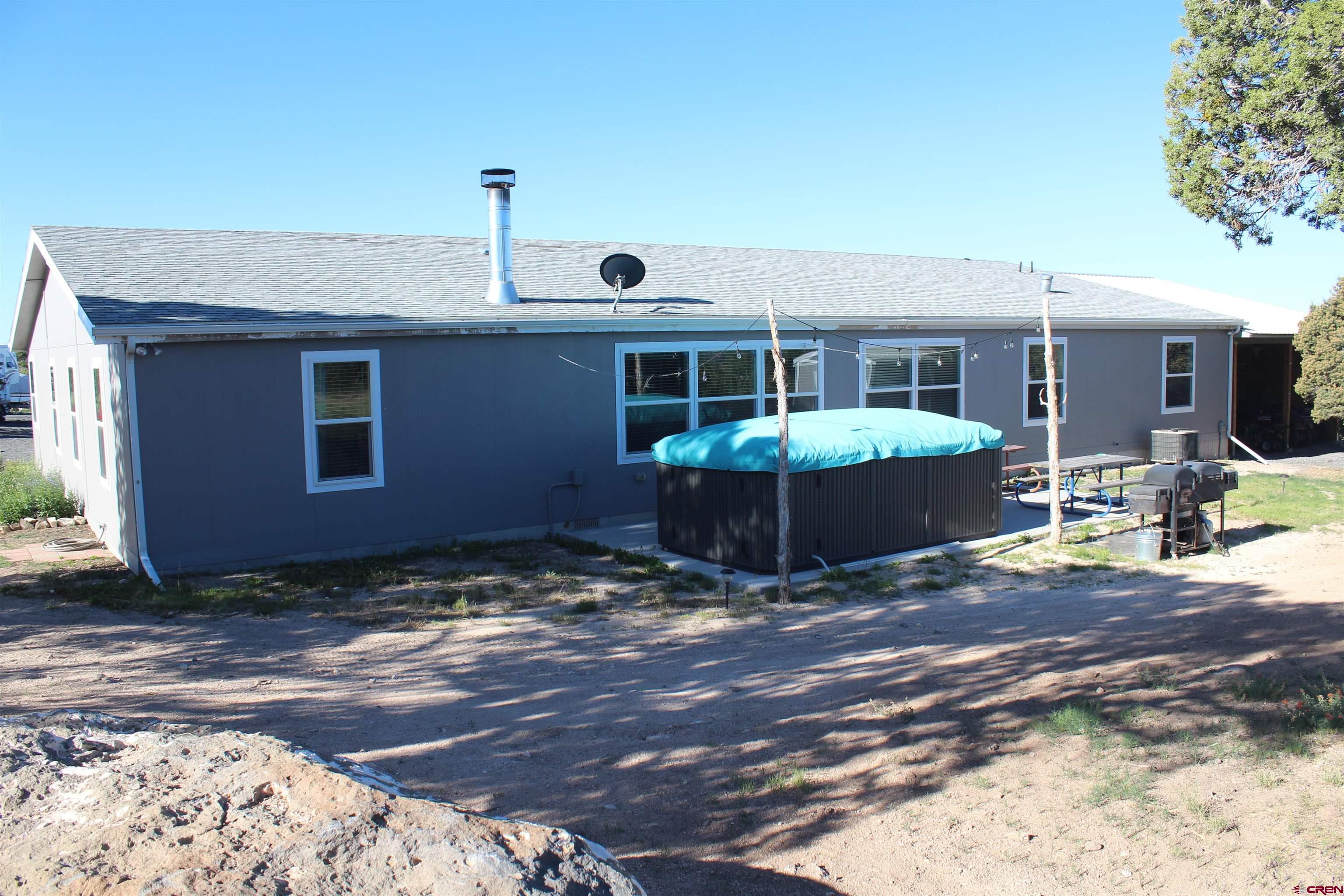 16875 Ember Road Cedaredge, CO 81413 - Photo 31 of 31 a view of a house with backyard