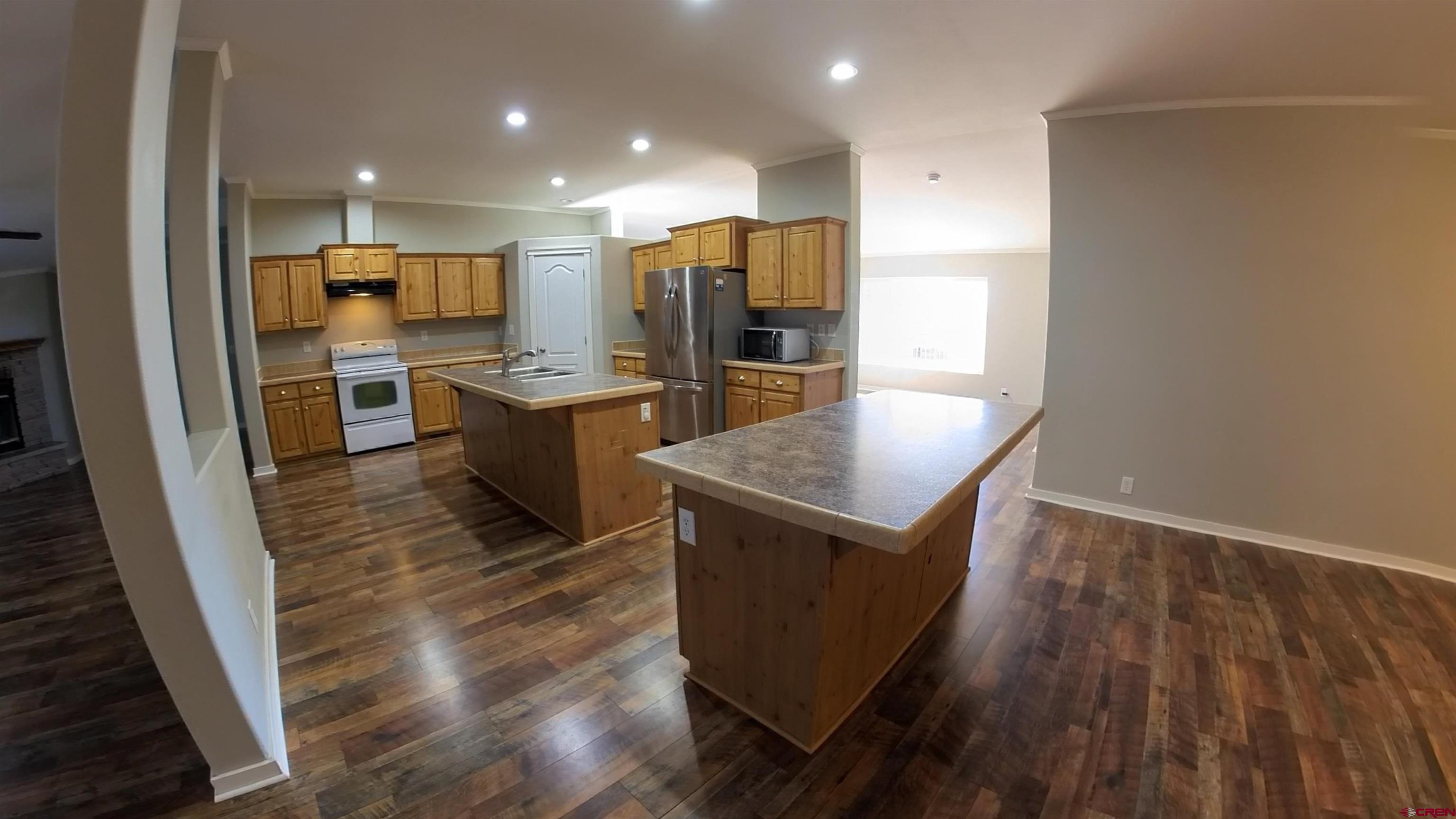 16875 Ember Road Cedaredge, CO 81413 - Photo 5 of 31 a kitchen with lots of counter top space and appliances