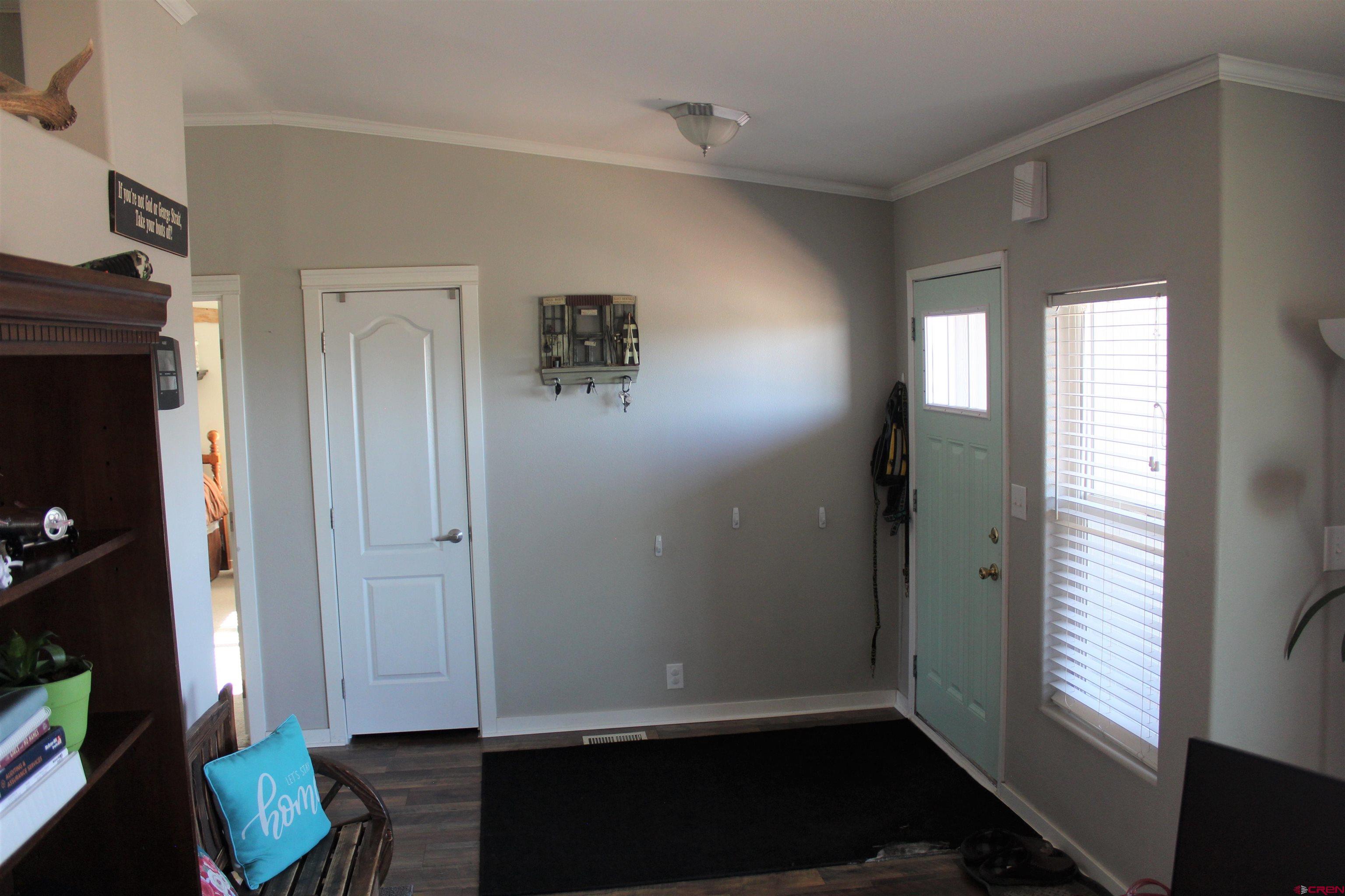 16875 Ember Road Cedaredge, CO 81413 - Photo 7 of 31 a view of livingroom with hardwood floor and a window