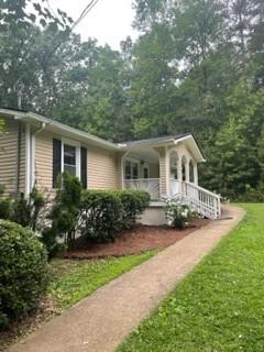 1918 Mulberry Rock Road Dallas, GA 30157 - Photo 1 of 1 a front view of a house with yard and green space
