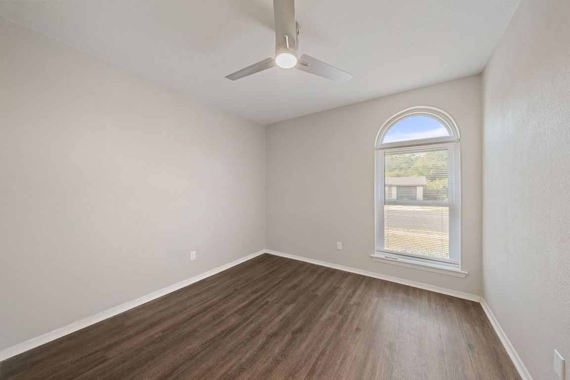 1810 Mearns Meadow Boulevard, Unit A Austin, TX 78758 - Photo 13 of 16 an empty room with a window