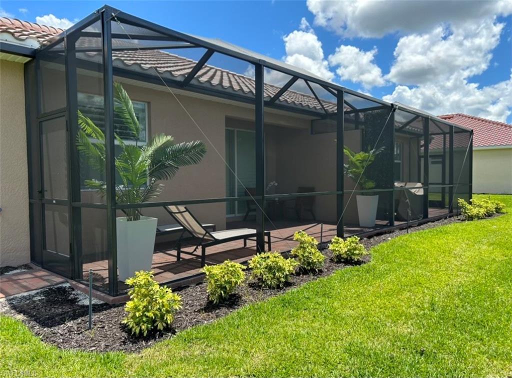 2084 Wellington Street Naples, FL 34120 - Photo 15 of 23 a garden view with a potted plant