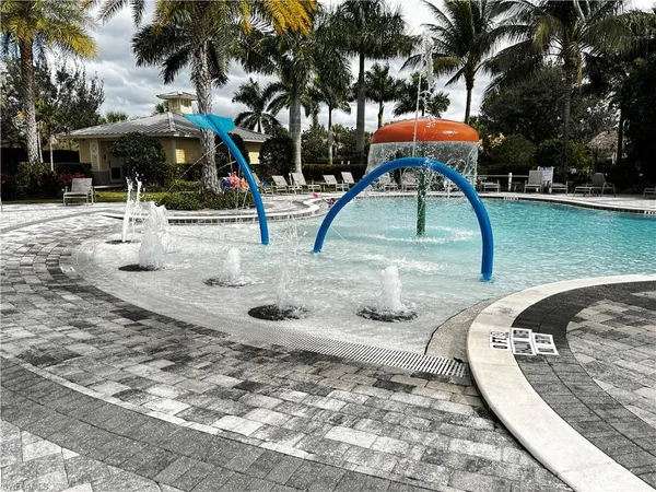 a view of outdoor space with playground and green space