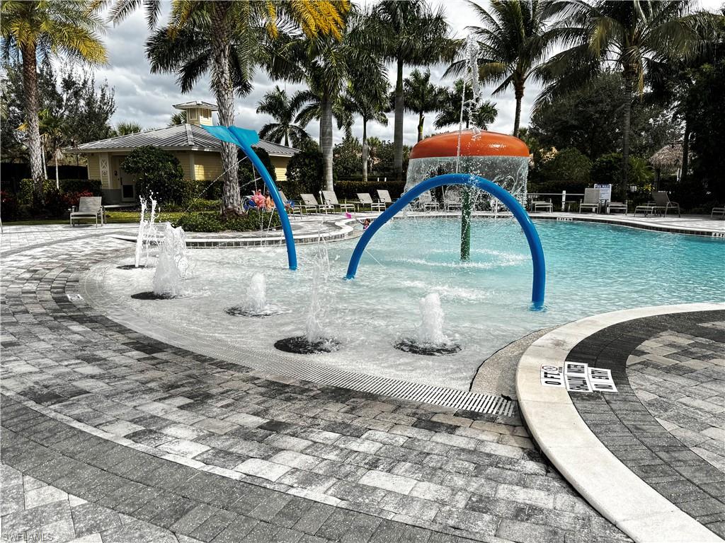 2084 Wellington Street Naples, FL 34120 - Photo 18 of 23 a view of outdoor space with playground and green space