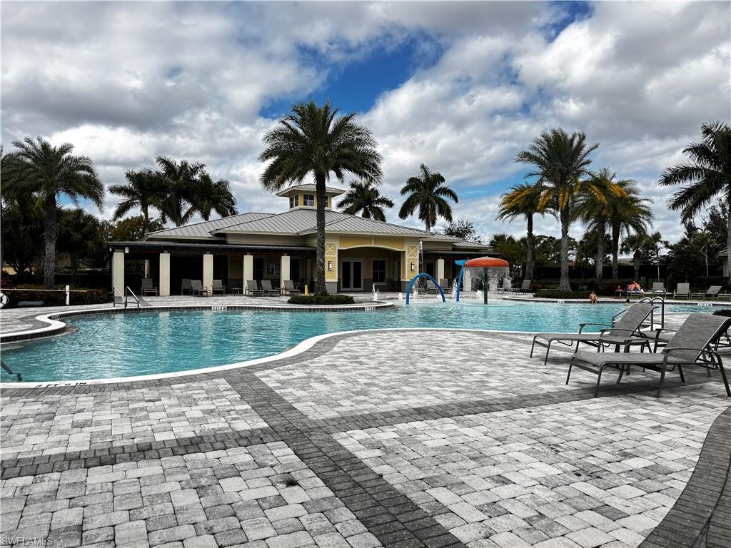2084 Wellington Street Naples, FL 34120 - Photo 22 of 23 a view of a house with a yard