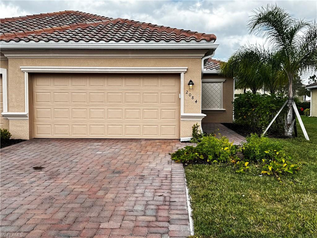 2084 Wellington Street Naples, FL 34120 - Photo 23 of 23 a front view of a house