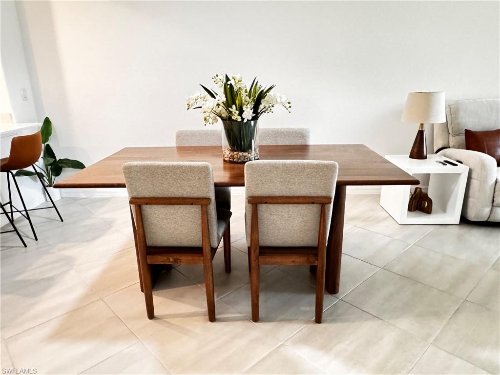2084 Wellington Street Naples, FL 34120 - Photo 5 of 23 a view of a dining room with furniture