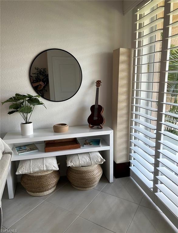 2084 Wellington Street Naples, FL 34120 - Photo 6 of 23 a kitchen with a stove and cabinets