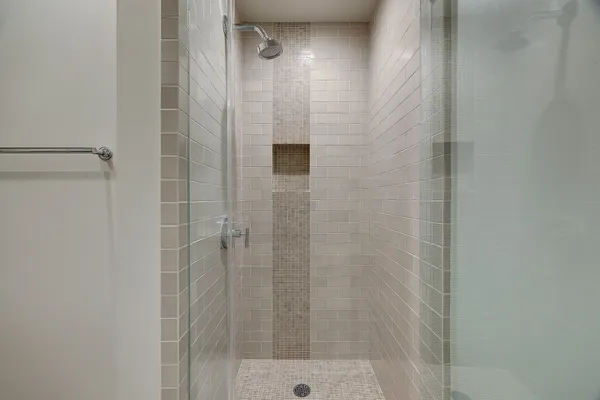 a bathroom with a granite countertop sink a toilet and a mirror