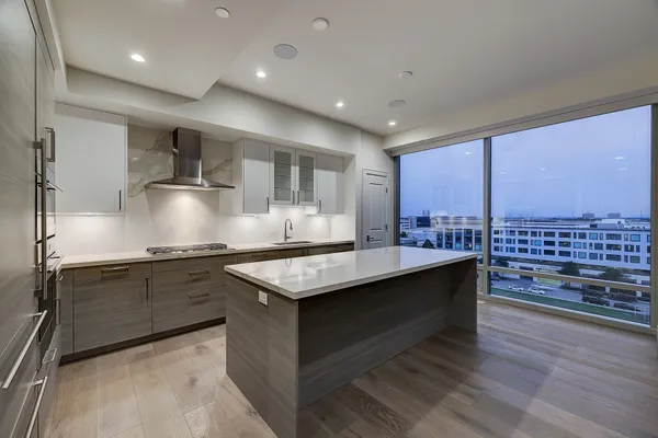 a stove top oven sitting inside of a kitchen
