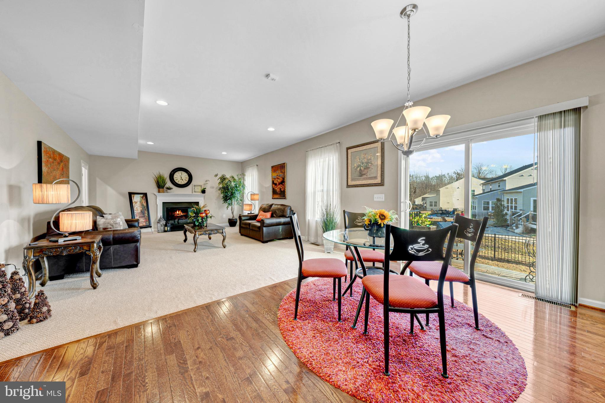 7137 Shepherdstown Road Warrenton, VA 20187 - Photo 16 of 60 a living room with furniture a chandelier and a table