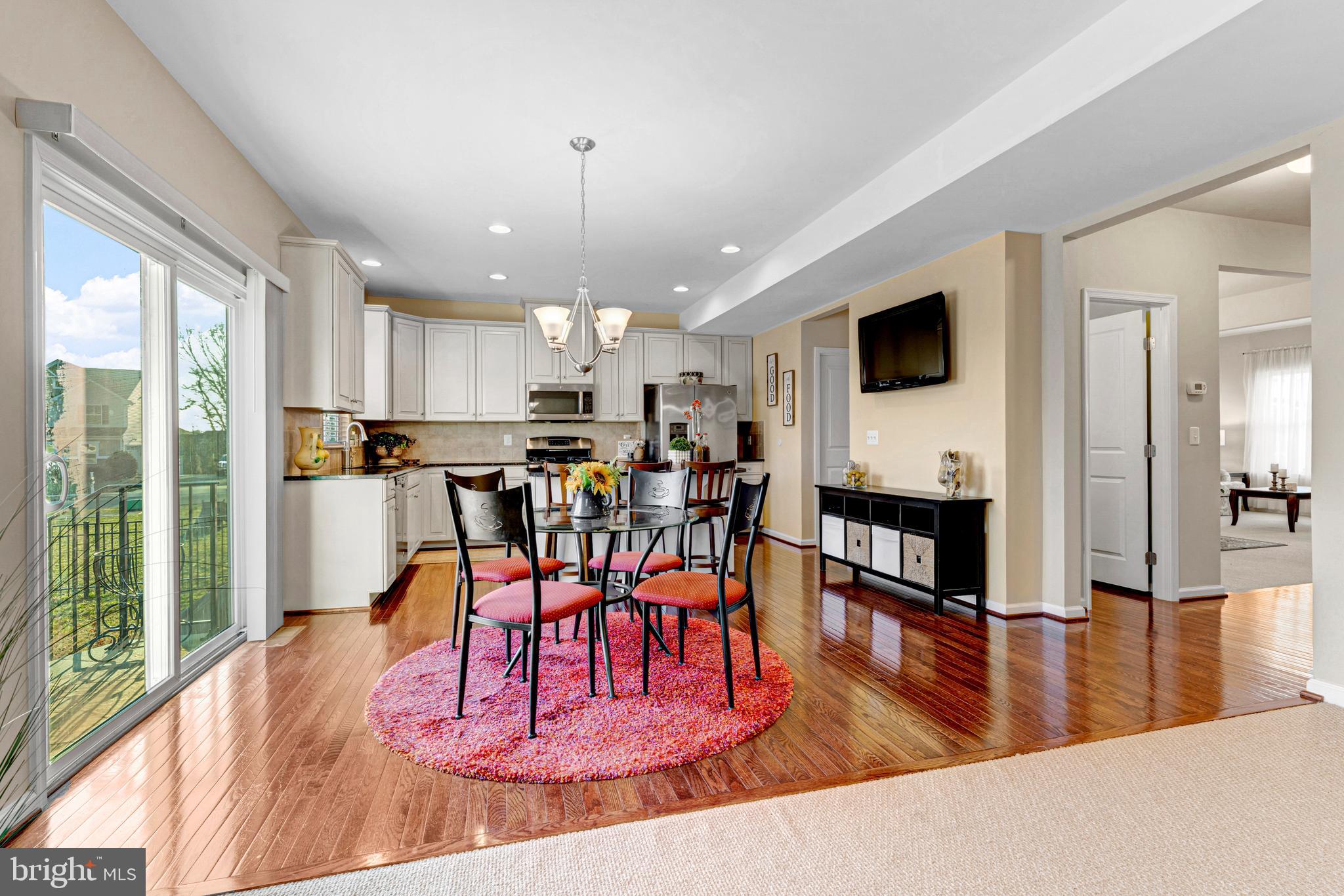 7137 Shepherdstown Road Warrenton, VA 20187 - Photo 17 of 60 a view of a dining room with furniture window and wooden floor