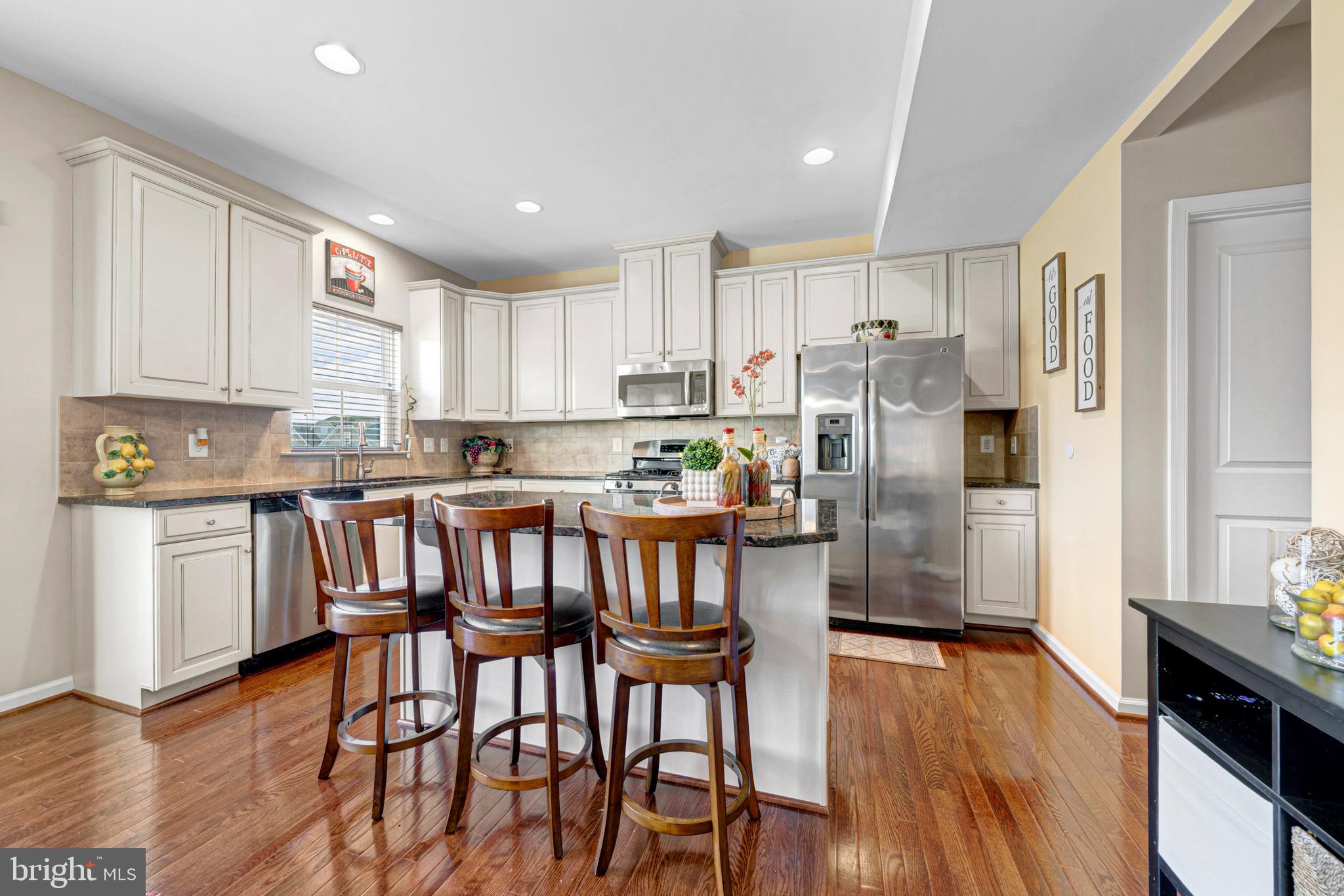7137 Shepherdstown Road Warrenton, VA 20187 - Photo 18 of 60 a kitchen with stainless steel appliances granite countertop a refrigerator a stove top oven a sink and cabinets