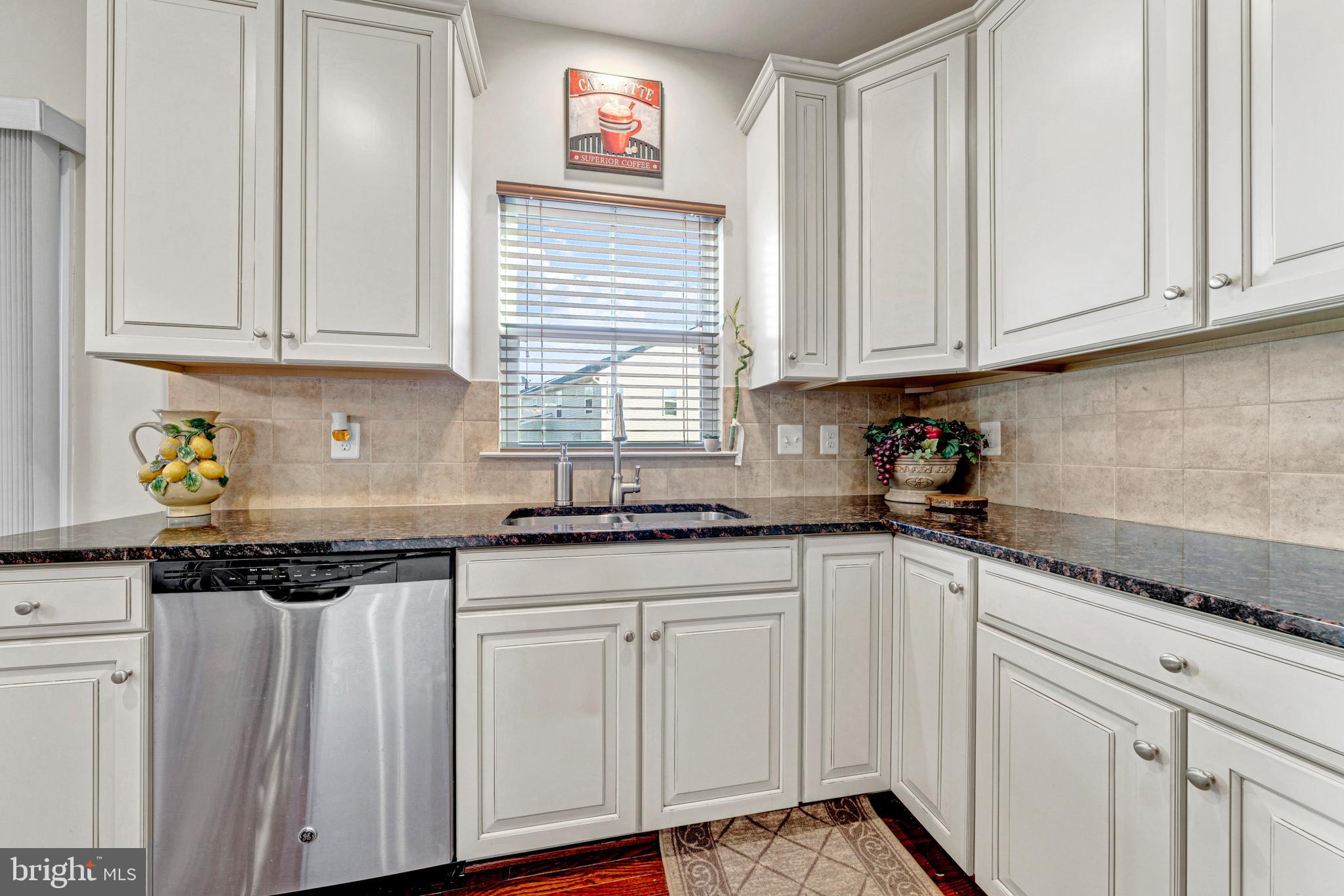 7137 Shepherdstown Road Warrenton, VA 20187 - Photo 22 of 60 a kitchen with granite countertop white cabinets and sink