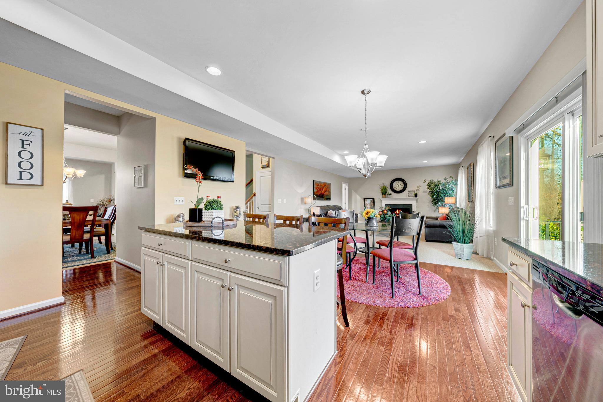 7137 Shepherdstown Road Warrenton, VA 20187 - Photo 23 of 60 a view of a dining room with furniture window and wooden floor