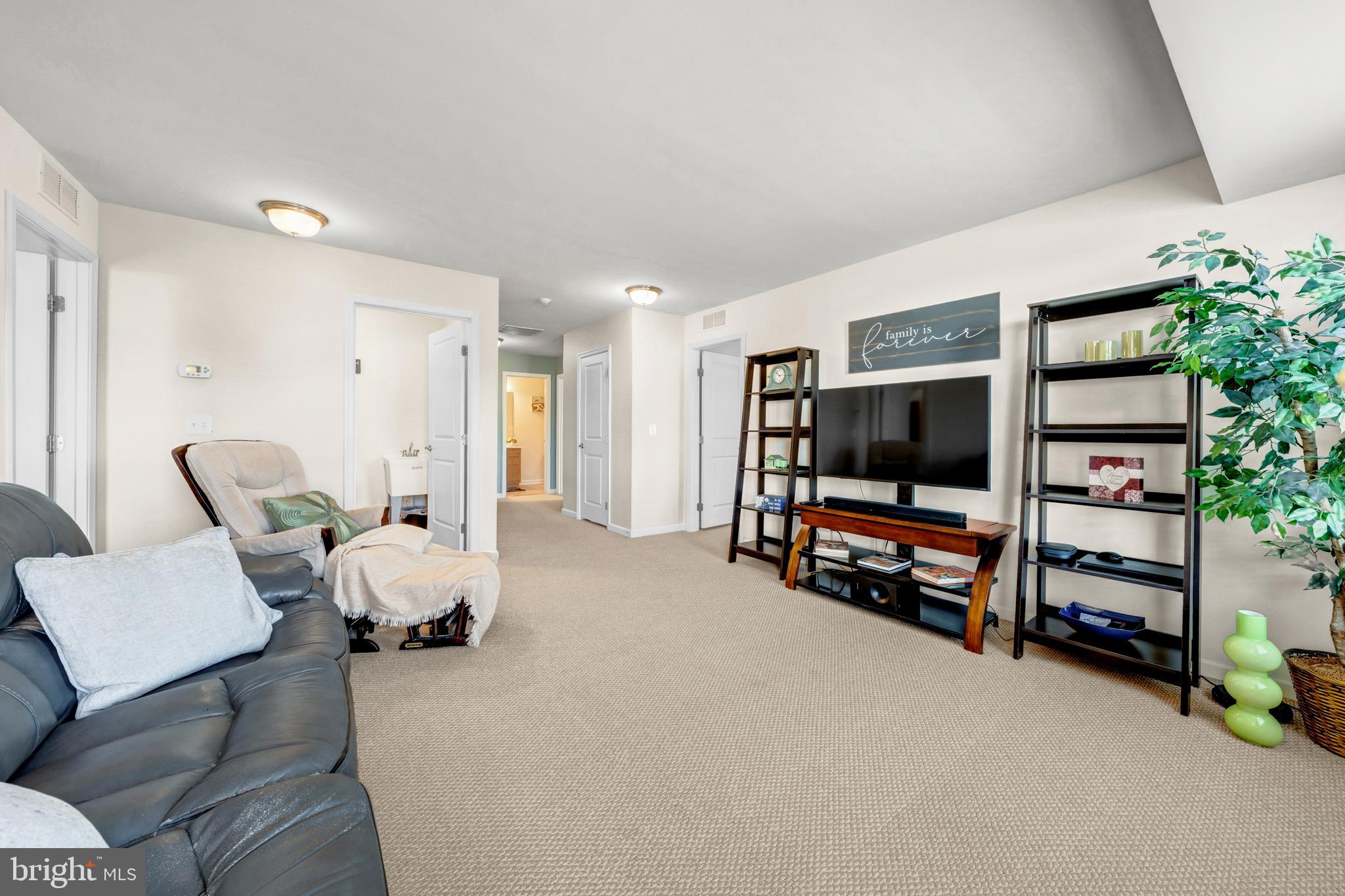 7137 Shepherdstown Road Warrenton, VA 20187 - Photo 27 of 60 a room with furniture and a flat screen tv