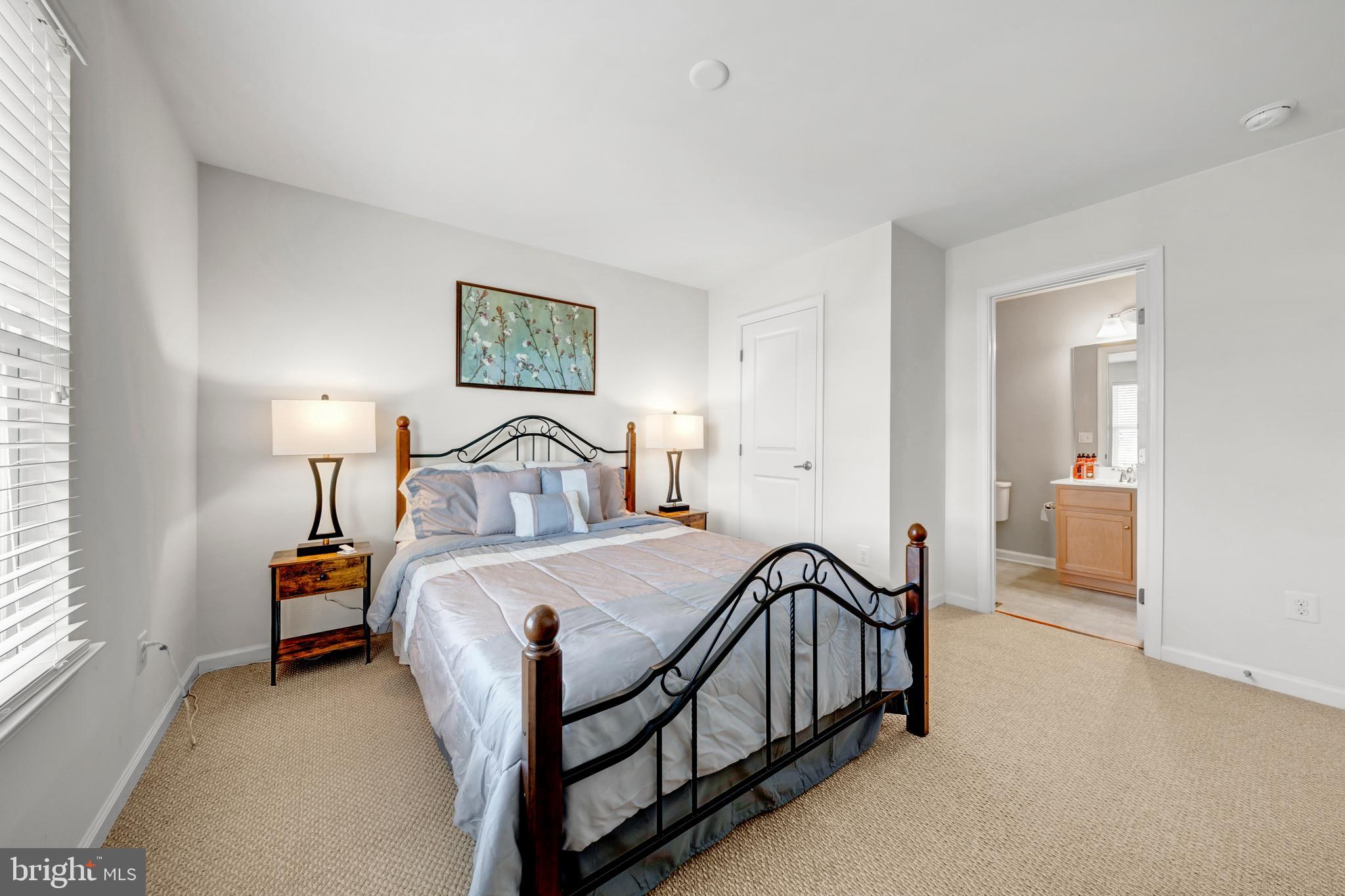 7137 Shepherdstown Road Warrenton, VA 20187 - Photo 34 of 60 a bedroom with a bed and a lamp